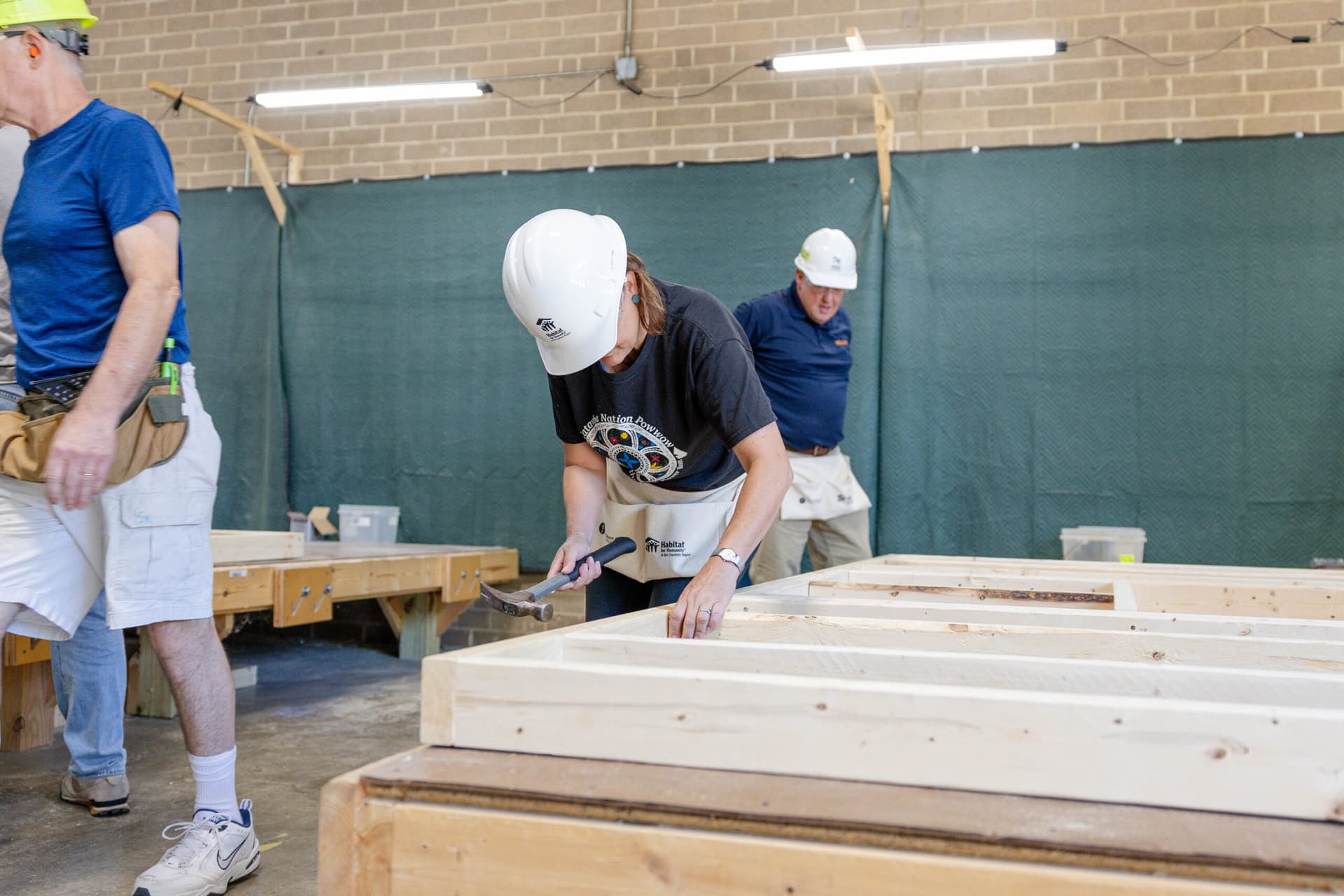 2026 CEO Build volunteer using a hammer