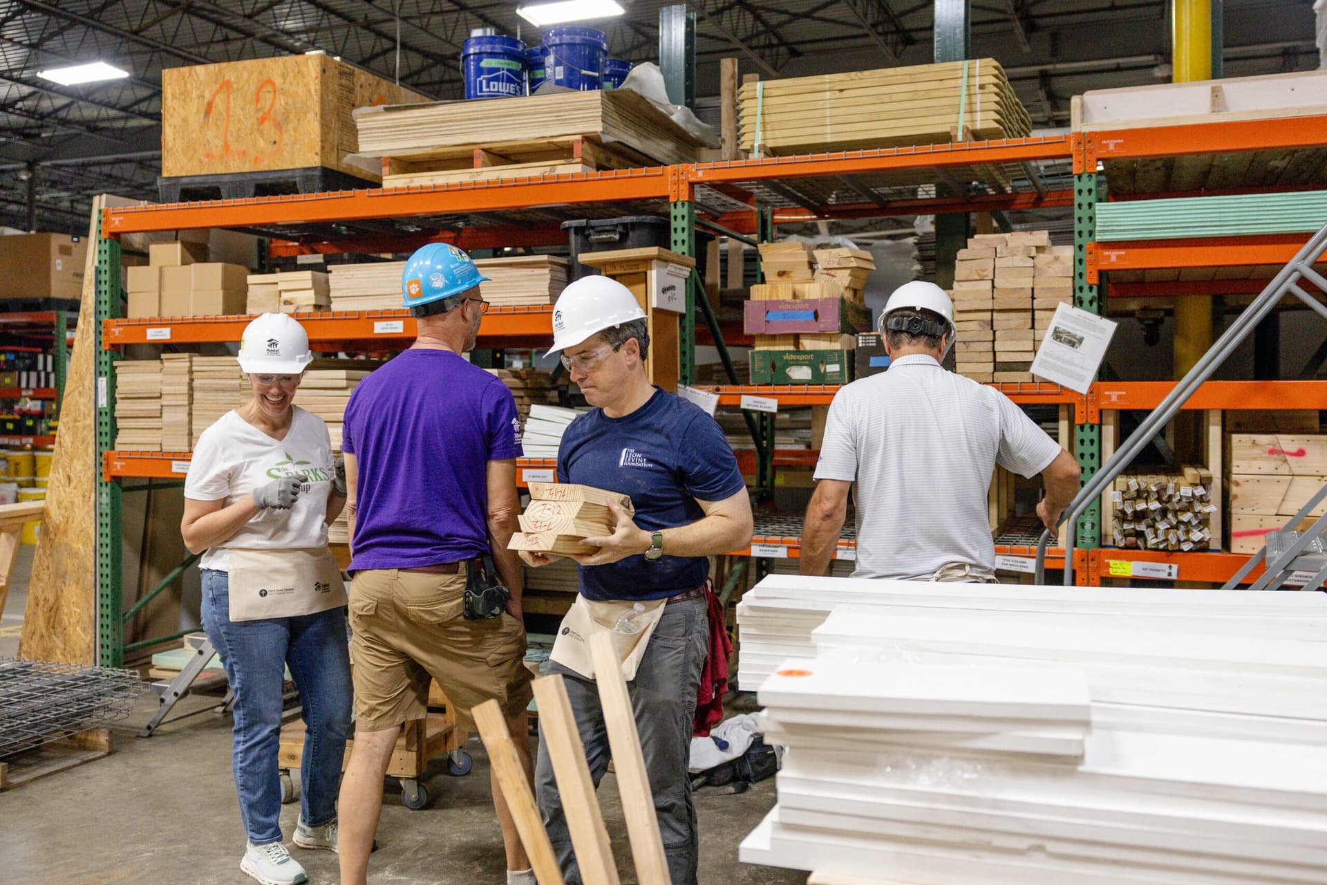 2026 CEO Build volunteers carrying materials