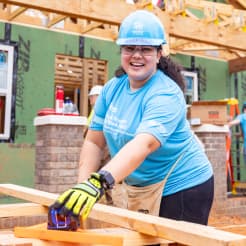 Volunteer building a home