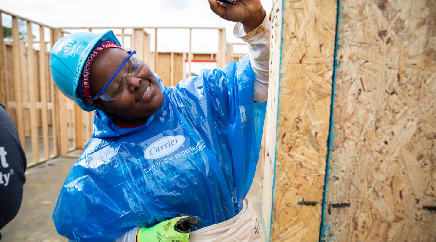 Habitat for Humanity volunteer building a home